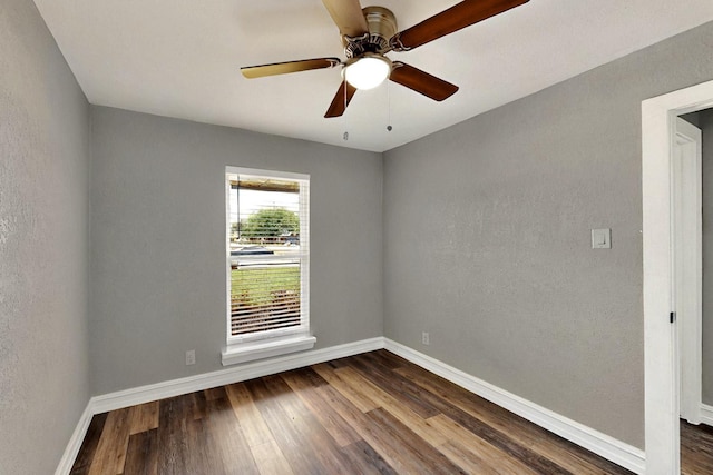 6912 Griggs St, Forest Hill, TX 76140 - spare room with dark wood-type flooring, baseboards, a textured wall, and ceiling fan