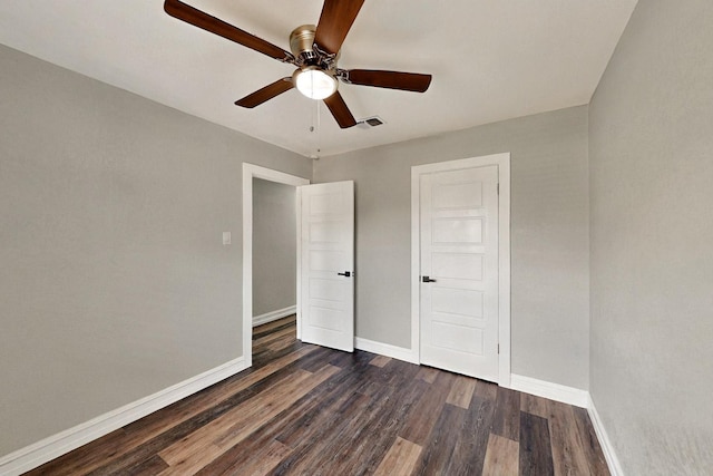 6912 Griggs St, Forest Hill, TX 76140 - unfurnished bedroom featuring baseboards, dark wood-style floors, and ceiling fan