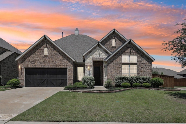 13736 Kevin Dr, Frisco, TX 75035 - french country home featuring driveway, brick siding, a garage, and a chimney