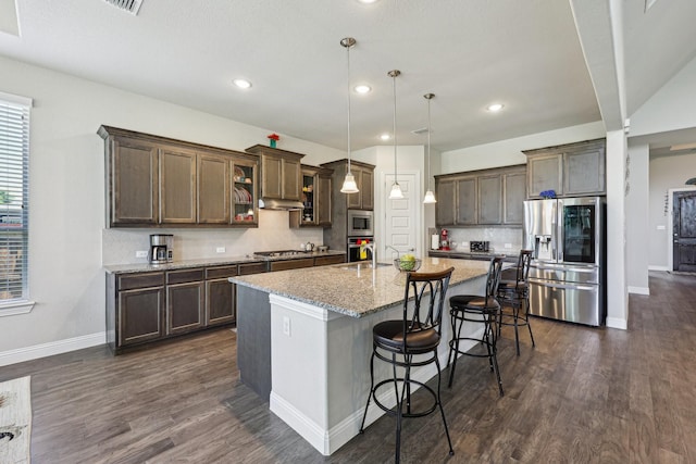 13736 Kevin Dr, Frisco, TX 75035 - kitchen featuring appliances with stainless steel finishes, baseboards, decorative backsplash, dark wood-type flooring, and recessed lighting