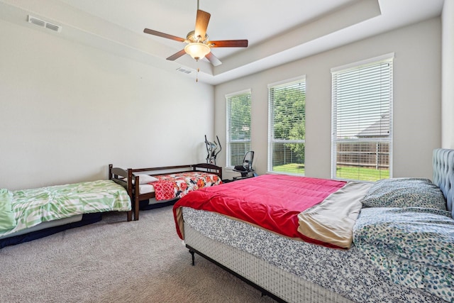 13736 Kevin Dr, Frisco, TX 75035 - carpeted bedroom with ceiling fan and a raised ceiling
