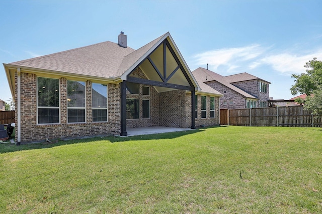 13736 Kevin Dr, Frisco, TX 75035 - back of house with a patio, brick siding, and a chimney