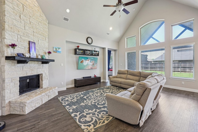 13736 Kevin Dr, Frisco, TX 75035 - living area featuring a ceiling fan, high vaulted ceiling, wood finished floors, a stone fireplace, and baseboards