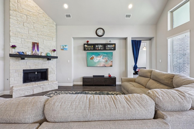 13736 Kevin Dr, Frisco, TX 75035 - living area with high vaulted ceiling, dark wood-type flooring, baseboards, and a fireplace