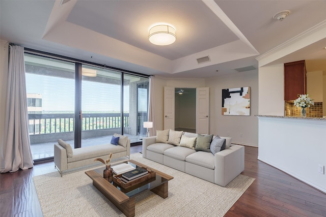 5909 Luther Ln Unit 2200, Dallas, TX 75225 - living area with a raised ceiling, dark wood finished floors, and baseboards