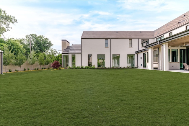 8404 Swananoah Rd, Dallas, TX 75209 - back of house with a chimney, a tile roof, and stucco siding