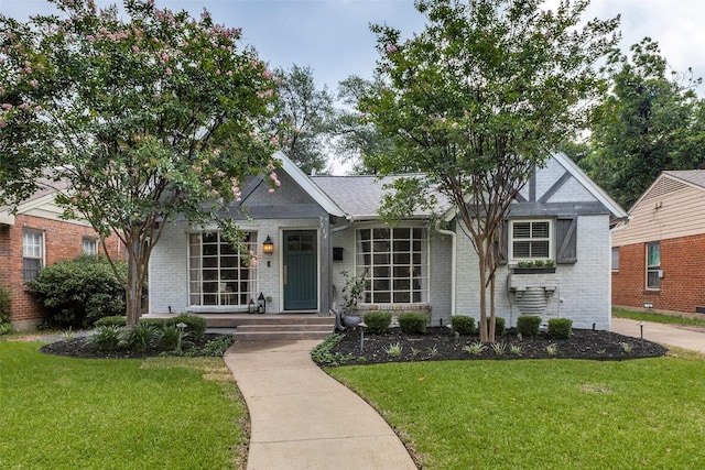 7514 Caillet St, Dallas, TX 75209 - view of front facade featuring brick siding and a front yard