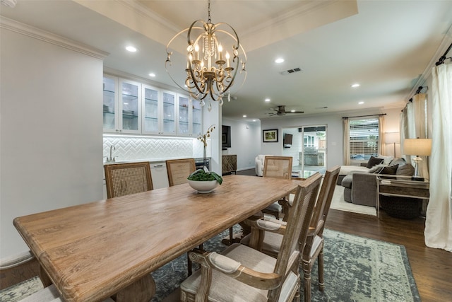 7514 Caillet St, Dallas, TX 75209 - dining space with recessed lighting, crown molding, a chandelier, dark wood-style flooring, and ceiling fan