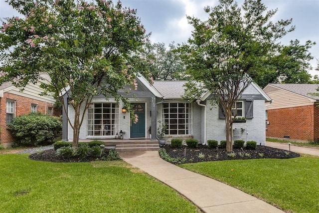 7514 Caillet St, Dallas, TX 75209 - view of front of property with a front yard and brick siding