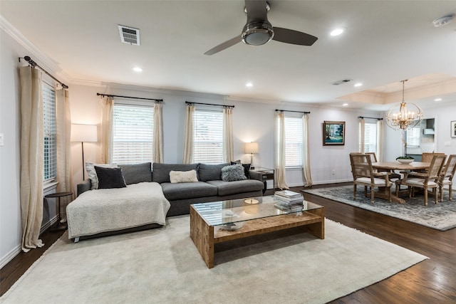 7514 Caillet St, Dallas, TX 75209 - living area with crown molding, ceiling fan, plenty of natural light, wood finished floors, and a chandelier