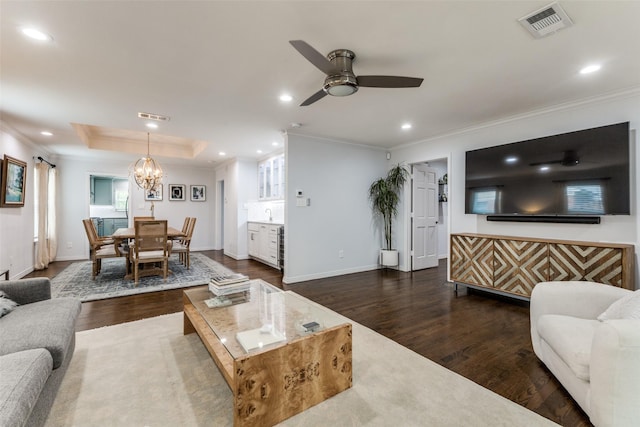 7514 Caillet St, Dallas, TX 75209 - living area featuring dark wood-type flooring, crown molding, recessed lighting, baseboards, and a chandelier