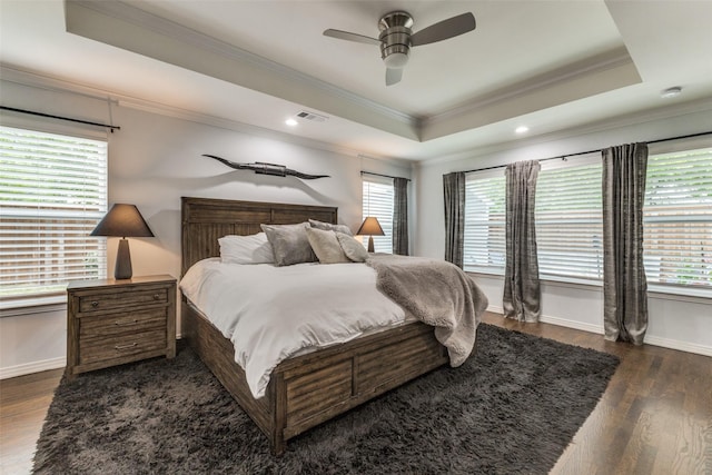 7514 Caillet St, Dallas, TX 75209 - bedroom featuring a raised ceiling, crown molding, dark wood-type flooring, baseboards, and recessed lighting
