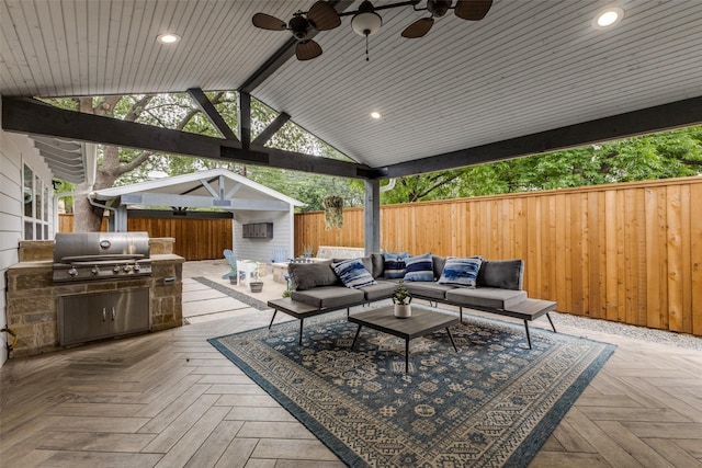 7514 Caillet St, Dallas, TX 75209 - view of patio / terrace featuring a grill, a fenced backyard, a wooden deck, ceiling fan, and an outdoor kitchen