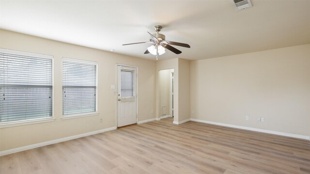 1508 Mockingbird Dr, Aubrey, TX 76227 - spare room featuring light wood-type flooring, ceiling fan, and baseboards