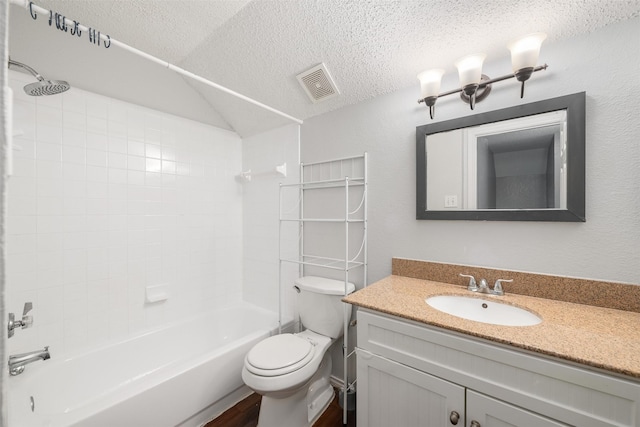 10315 Budtime Ln, Dallas, TX 75217 - full bath featuring a textured ceiling, toilet, bathing tub / shower combination, vanity, and wood finished floors