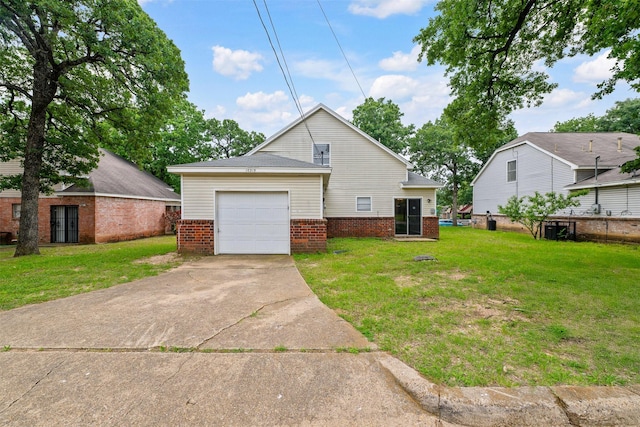 10315 Budtime Ln, Dallas, TX 75217 - rear view of house featuring a garage, brick siding, and driveway