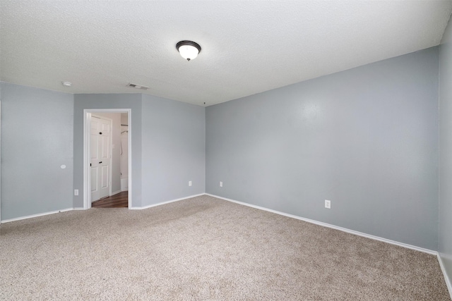 10315 Budtime Ln, Dallas, TX 75217 - unfurnished room with carpet flooring, baseboards, and a textured ceiling