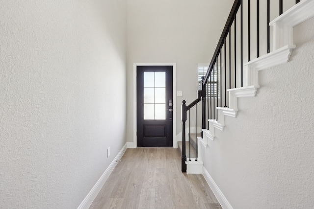 510 Willet Dr, Mckinney, TX 75069 - entryway featuring wood finished floors, stairway, a textured wall, and baseboards