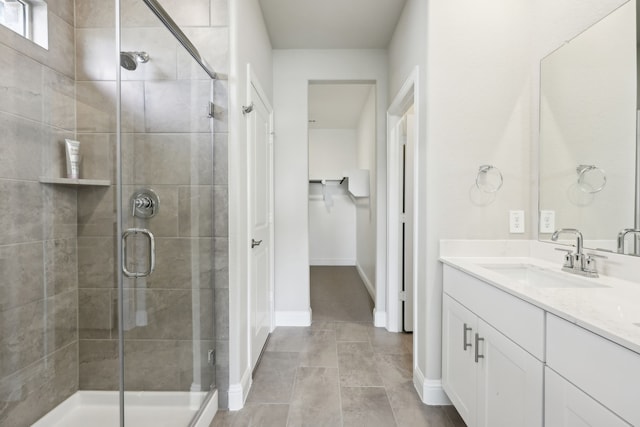 510 Willet Dr, Mckinney, TX 75069 - bathroom with a shower stall, vanity, baseboards, and tile patterned flooring
