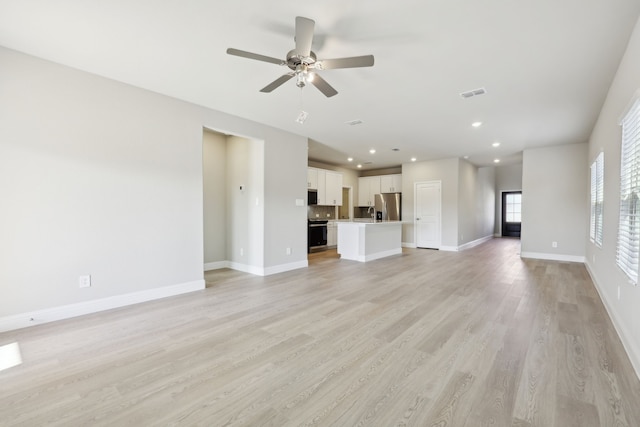 510 Willet Dr, Mckinney, TX 75069 - unfurnished living room featuring a ceiling fan, light wood-style flooring, baseboards, and recessed lighting