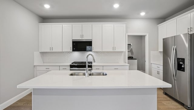 516 Willet Dr, Mckinney, TX 75069 - kitchen with stainless steel refrigerator with ice dispenser, decorative backsplash, light wood-type flooring, white cabinetry, and recessed lighting