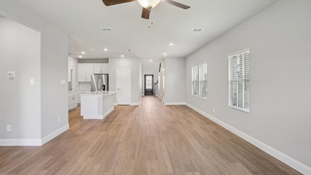 516 Willet Dr, Mckinney, TX 75069 - unfurnished living room with ceiling fan, light wood-style floors, and recessed lighting