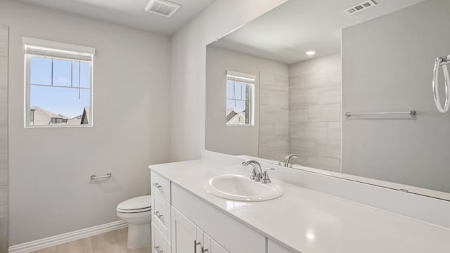 516 Willet Dr, Mckinney, TX 75069 - bathroom featuring vanity, plenty of natural light, and wood finished floors