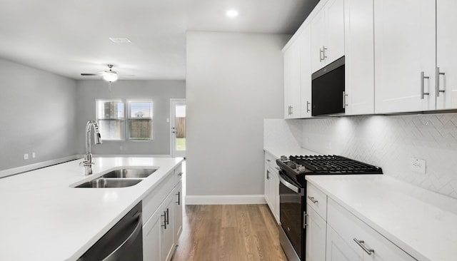 516 Willet Dr, Mckinney, TX 75069 - kitchen featuring black range with gas cooktop, dishwasher, light wood-style flooring, light countertops, and recessed lighting