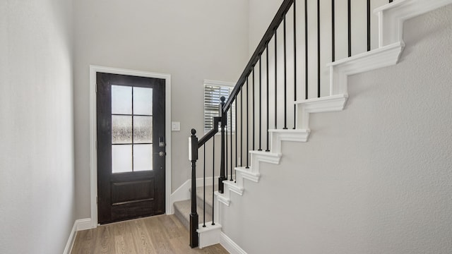 516 Willet Dr, Mckinney, TX 75069 - entrance foyer with wood finished floors, stairs, and a towering ceiling