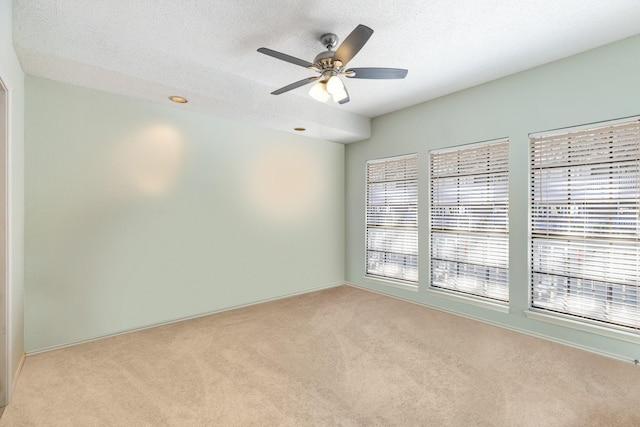 3101 Townbluff Dr Unit 1013, Plano, TX 75075 - empty room featuring carpet flooring, healthy amount of natural light, a textured ceiling, and ceiling fan