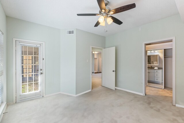 3101 Townbluff Dr Unit 1013, Plano, TX 75075 - unfurnished bedroom with carpet, access to exterior, baseboards, and a ceiling fan