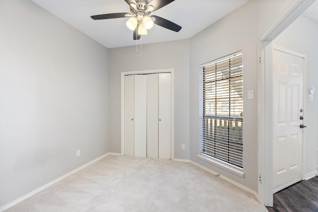 3101 Townbluff Dr Unit 1013, Plano, TX 75075 - unfurnished bedroom with carpet flooring, baseboards, a closet, and a ceiling fan