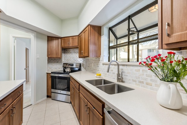 3101 Townbluff Dr Unit 1013, Plano, TX 75075 - kitchen with appliances with stainless steel finishes, a sink, decorative backsplash, and light countertops