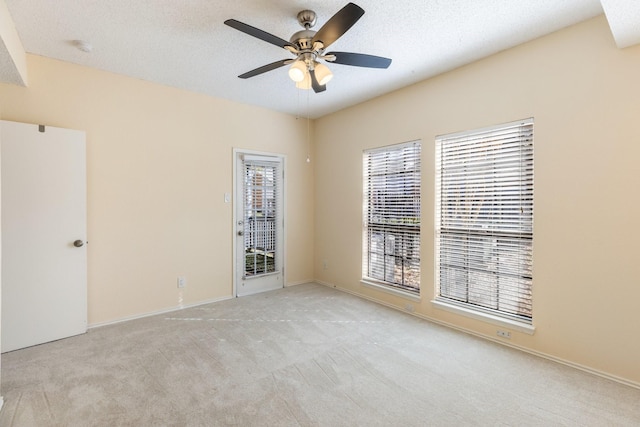 3101 Townbluff Dr Unit 1013, Plano, TX 75075 - carpeted empty room featuring a ceiling fan and a textured ceiling