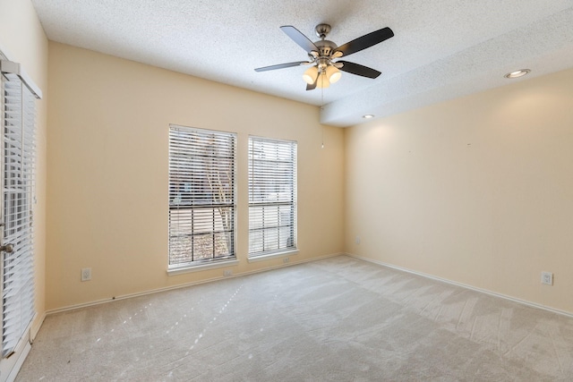3101 Townbluff Dr Unit 1013, Plano, TX 75075 - unfurnished room with carpet, a ceiling fan, a textured ceiling, and baseboards