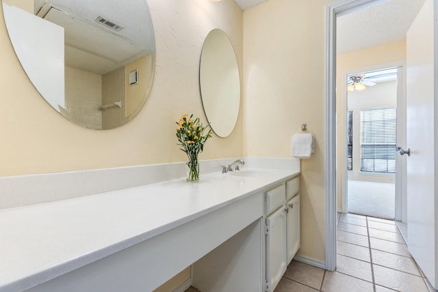 3101 Townbluff Dr Unit 1013, Plano, TX 75075 - bathroom with vanity, tile patterned floors, a ceiling fan, and baseboards
