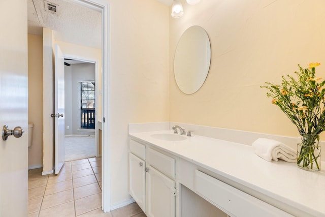 3101 Townbluff Dr Unit 1013, Plano, TX 75075 - bathroom featuring vanity, tile patterned flooring, and baseboards