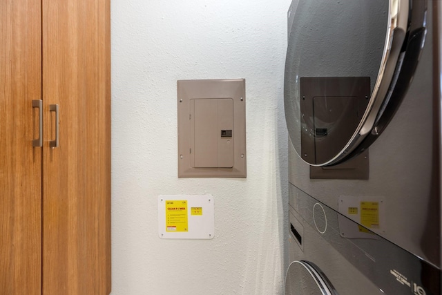 3101 Townbluff Dr Unit 1013, Plano, TX 75075 - laundry room featuring electric panel and estacked washer and dryer