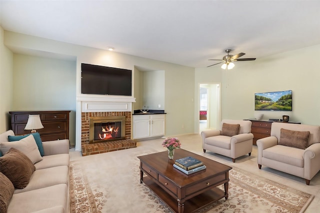 3101 Townbluff Dr Unit 1013, Plano, TX 75075 - living room featuring ceiling fan, a brick fireplace, and light colored carpet
