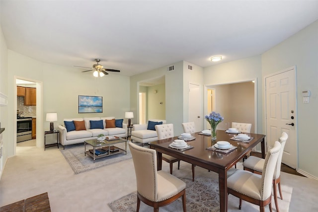 3101 Townbluff Dr Unit 1013, Plano, TX 75075 - dining room with a ceiling fan and light colored carpet