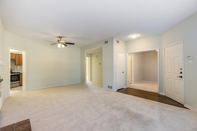 3101 Townbluff Dr Unit 1013, Plano, TX 75075 - unfurnished living room with light carpet, ceiling fan, and baseboards