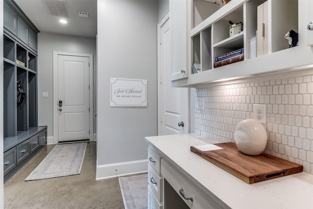 3970 Cobblestone Cir, Dallas, TX 75229 - mudroom with concrete floors and baseboards