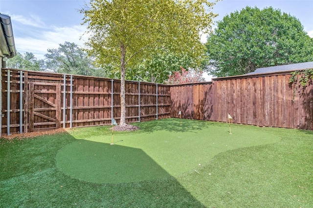 3970 Cobblestone Cir, Dallas, TX 75229 - view of yard with an area to practice putting and fence
