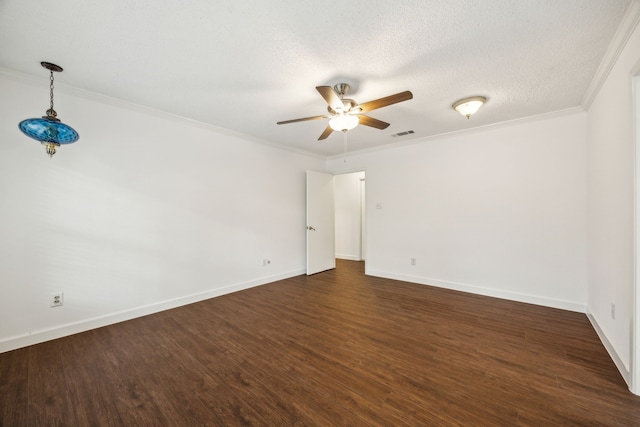 2207 Oakwood Ln, Arlington, TX 76012 - spare room featuring a ceiling fan, dark wood finished floors, baseboards, and crown molding