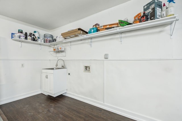 2207 Oakwood Ln, Arlington, TX 76012 - clothes washing area featuring washer hookup, dark wood finished floors, electric dryer hookup, and baseboards