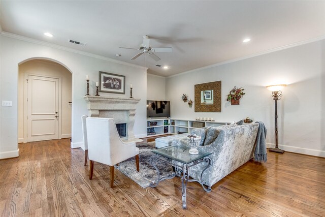 6521 Del Norte Ln, Dallas, TX 75225 - living area with ceiling fan, arched walkways, wood finished floors, ornamental molding, and baseboards