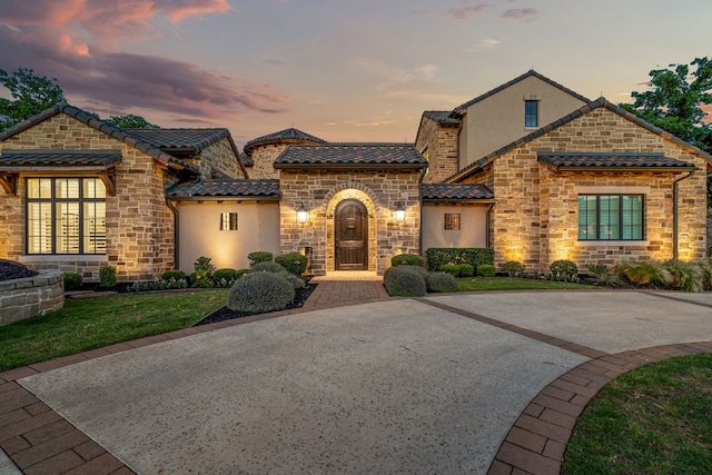 2210 Barcelona Ct, Westlake, TX 76262 - view of front of home featuring stone siding, stucco siding, a tiled roof, and a front yard