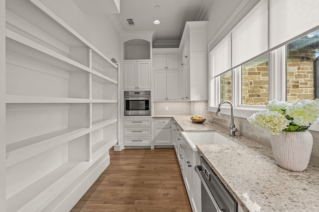 2210 Barcelona Ct, Westlake, TX 76262 - kitchen with appliances with stainless steel finishes, open shelves, a sink, light stone counters, and white cabinets