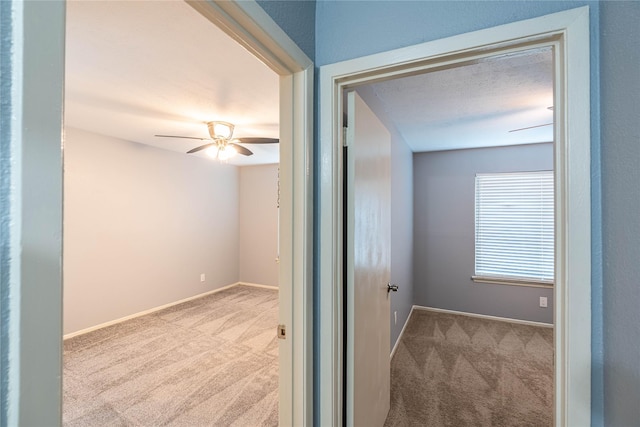 13561 Waterfall Way, Dallas, TX 75240 - empty room with carpet floors, a ceiling fan, and baseboards