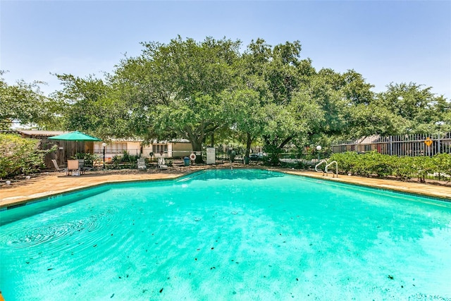 13561 Waterfall Way, Dallas, TX 75240 - community pool with fence and a patio